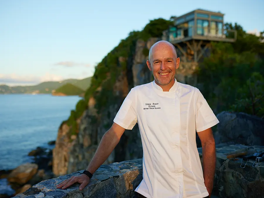 Steele Point’s private chef on the estate grounds with the Treehouse villa perched on the cliff behind