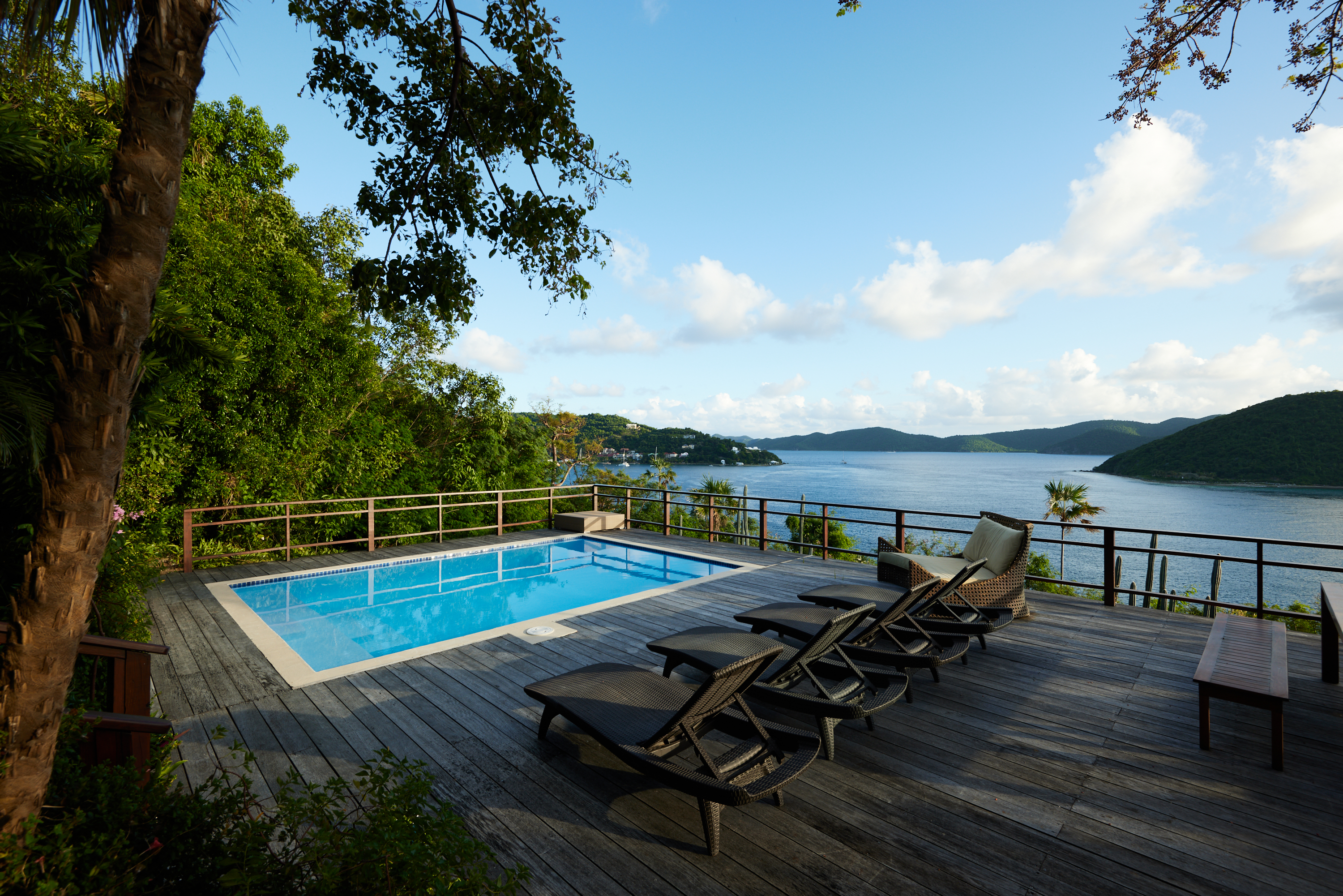 Pool deck with loungers and Caribbean views at Gestalt Villa Steele Point